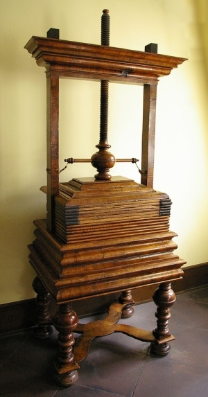 Substantial wooden press carved to echo linen folds